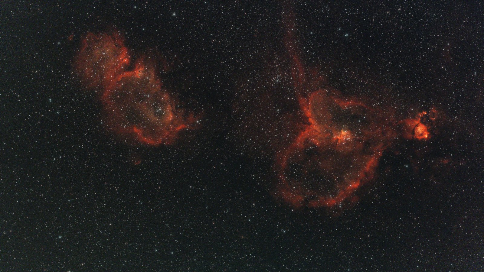 The Heart and Soul nebulae side by side in red